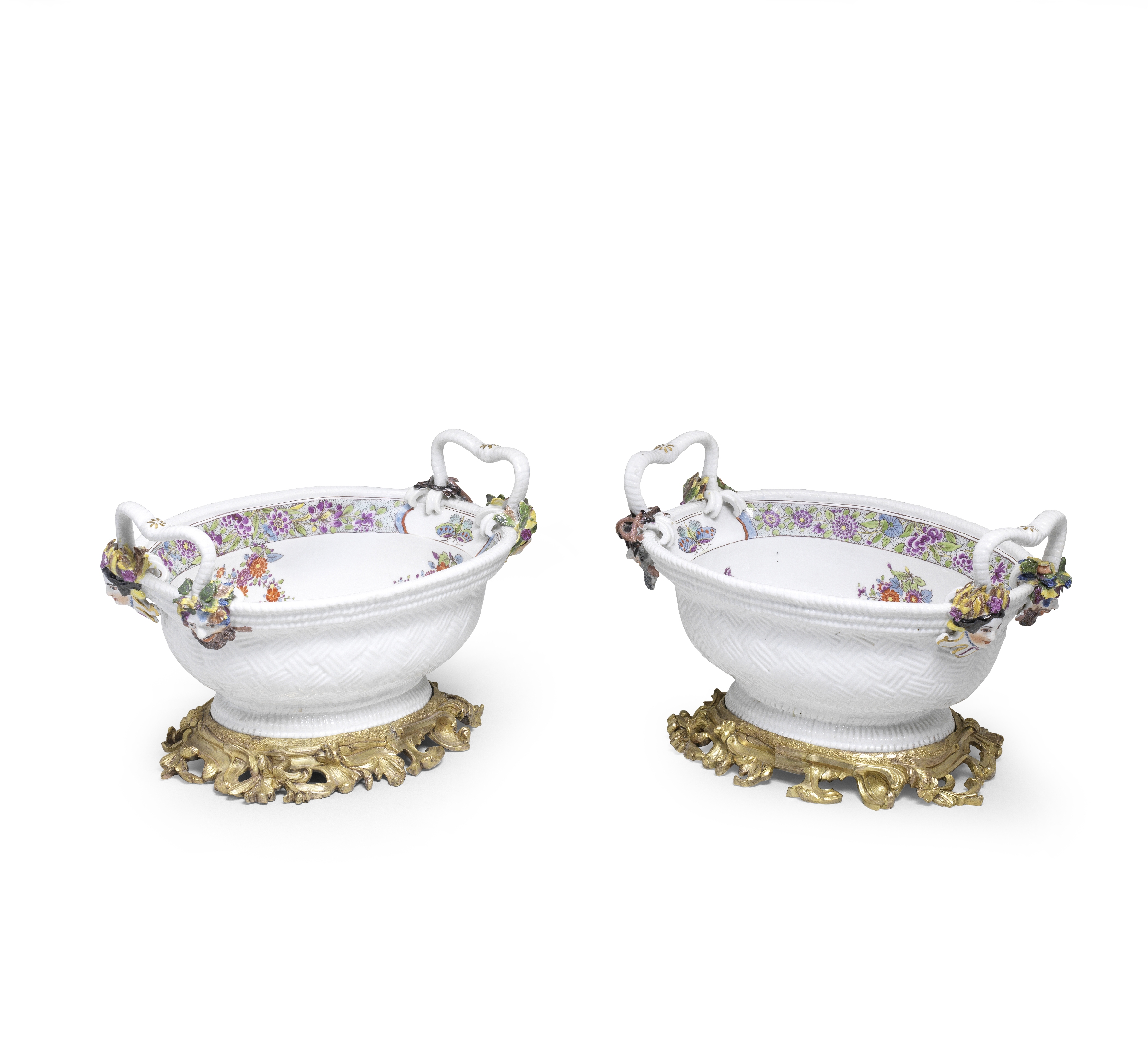 A pair of Meissen gilt-bronze-mounted two-handled oval baskets, circa 1735