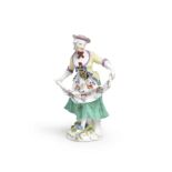 A Meissen figure of a lady dancing, mid 18th century