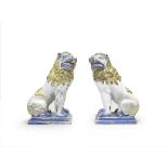 A pair of large French faience models of lions, circa 1800