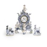 A Meissen figural clock case, late 19th century, together with a pair of Meissen groups, late 19t...