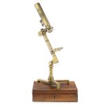 An Abraham brass monocular compound microscope, English, first quarter of 19th century,