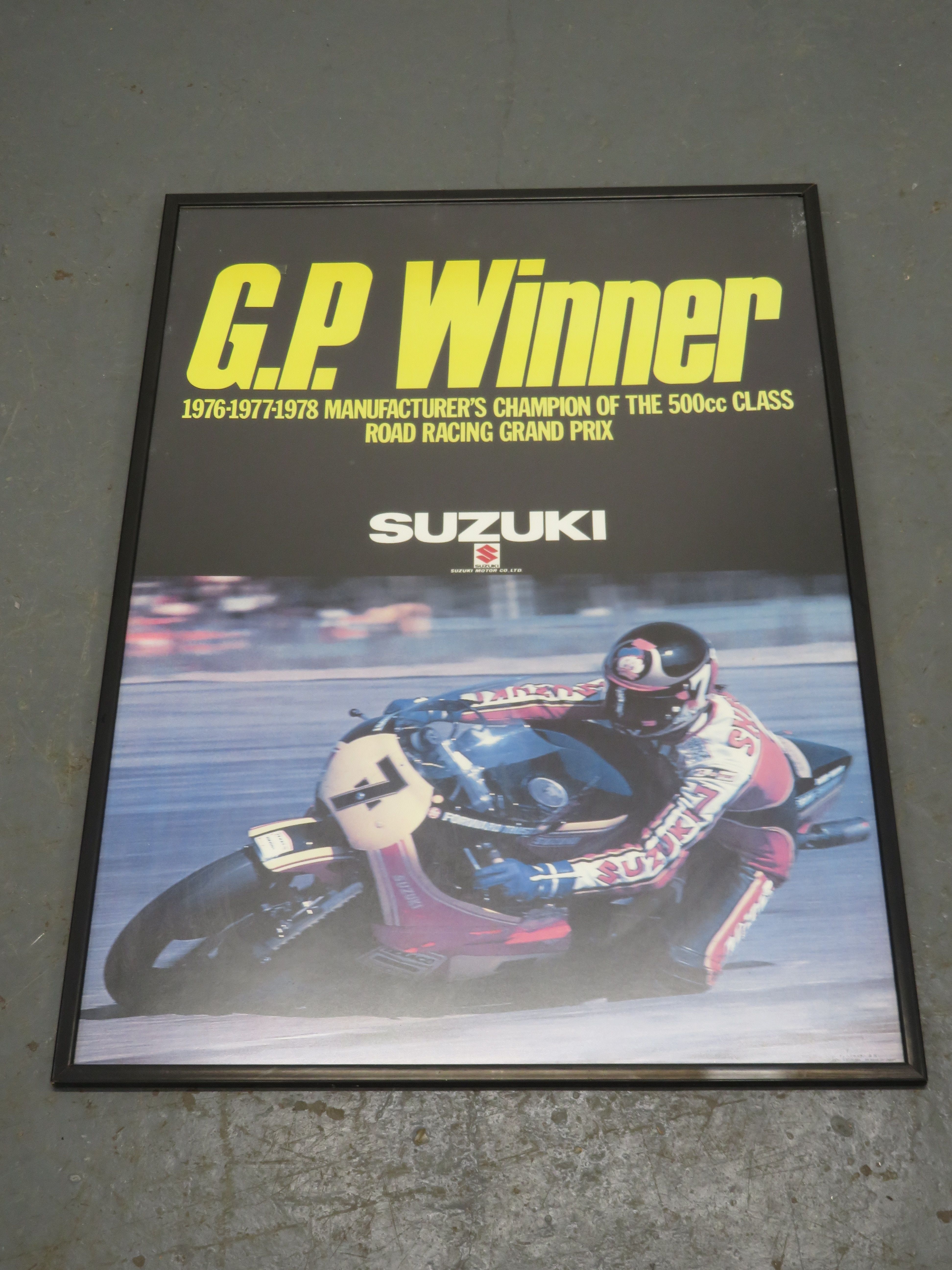A large 'GP Winner' Suzuki advertising poster
