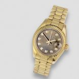 Rolex. A lady's 18K gold and diamond set automatic calendar bracelet watch with mother of pearl d...