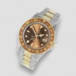 Rolex. A stainless steel and gold automatic calendar bracelet watch with dual time zone GMT Mast...