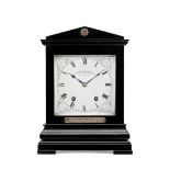 A late 19th century ebonised mantel clock presented by Lord Churchill Payne & Co, 163 New Bond St...