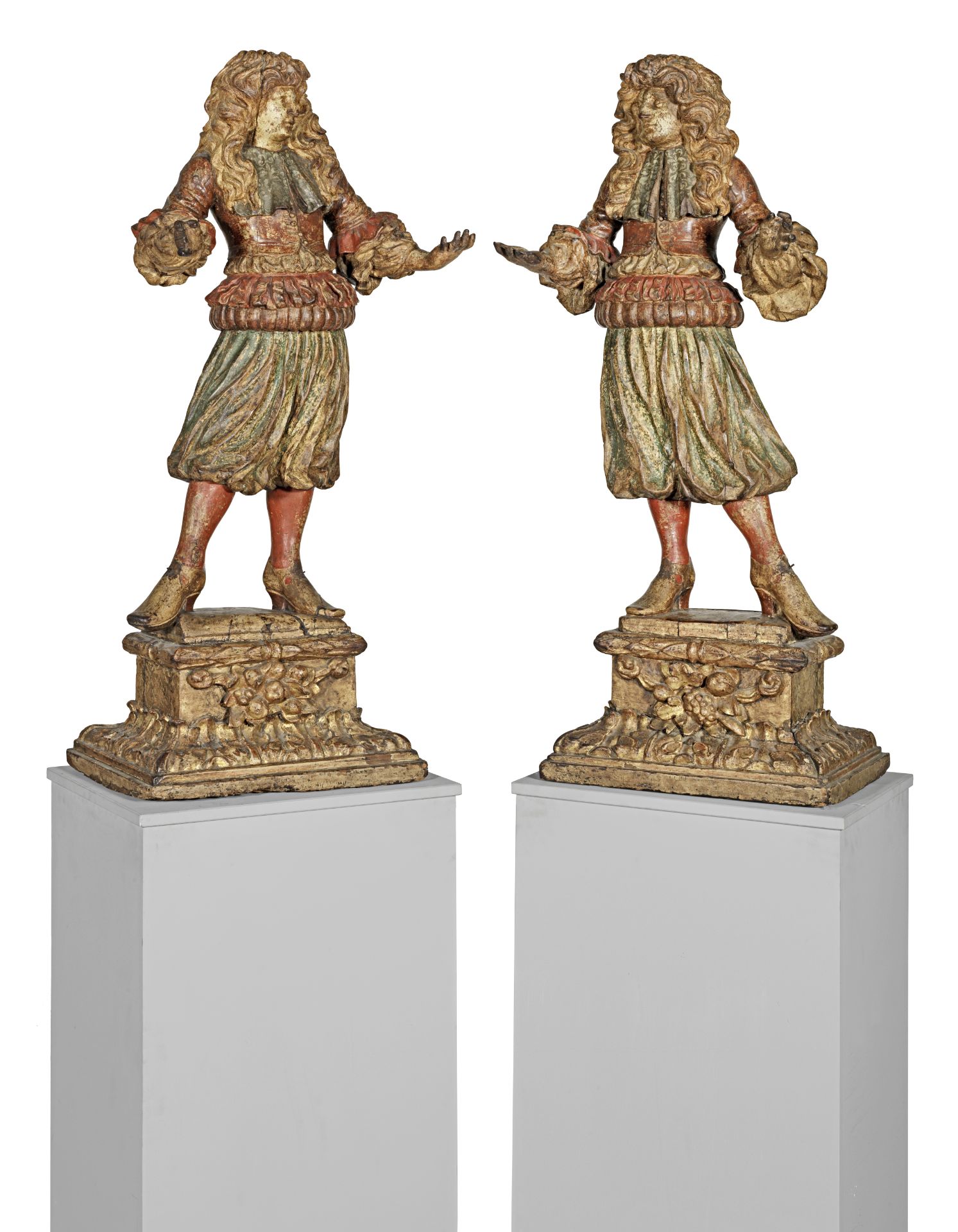 A good pair of late 17th century Italian carved and polychrome wood figures of courtly gentlemen (4)