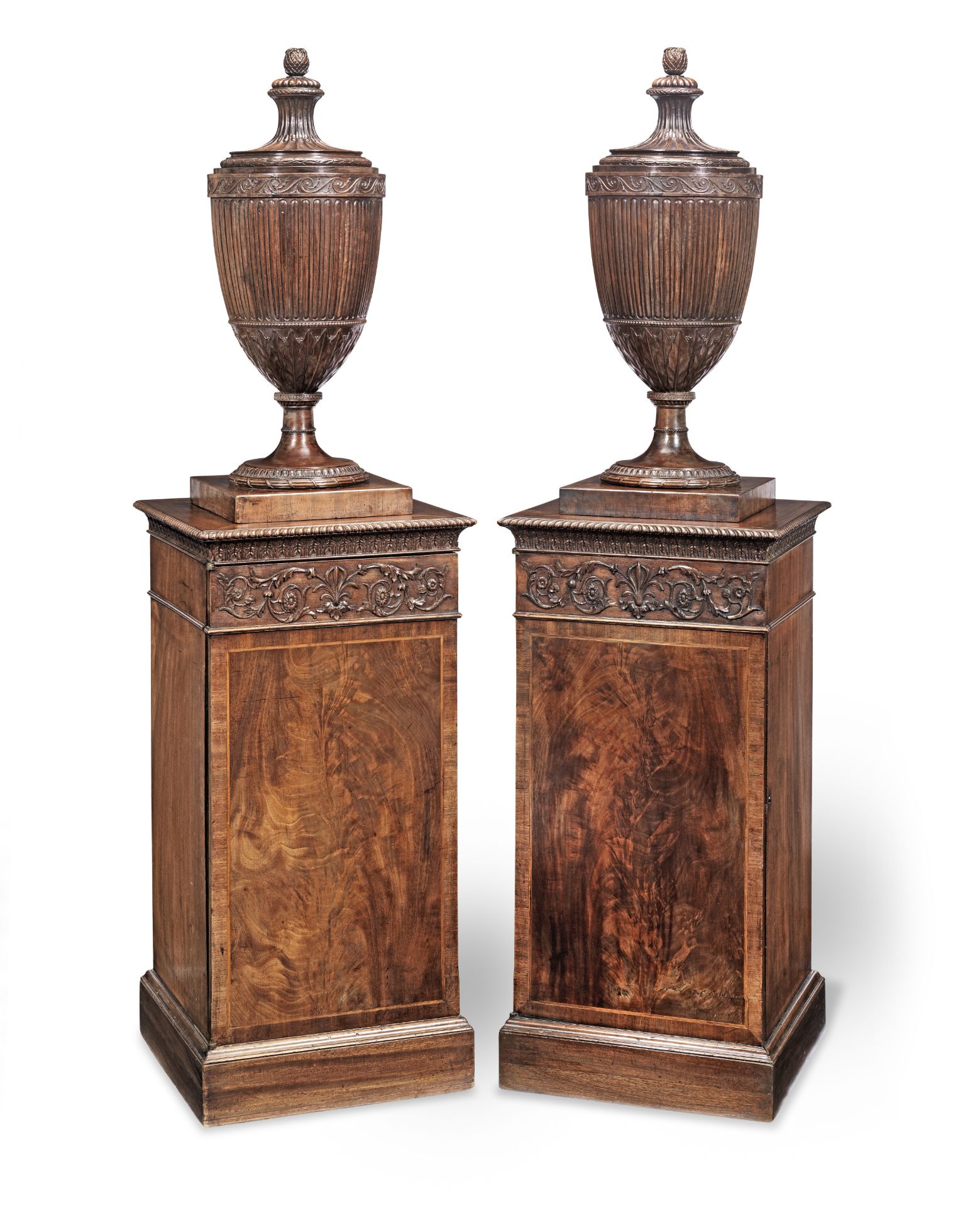 A pair of George III mahogany urns and pedestals (2)