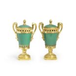 A pair of Louis XVI gilt bronze and apple-green glazed S&#232;vres porcelain pot pourri vases and...