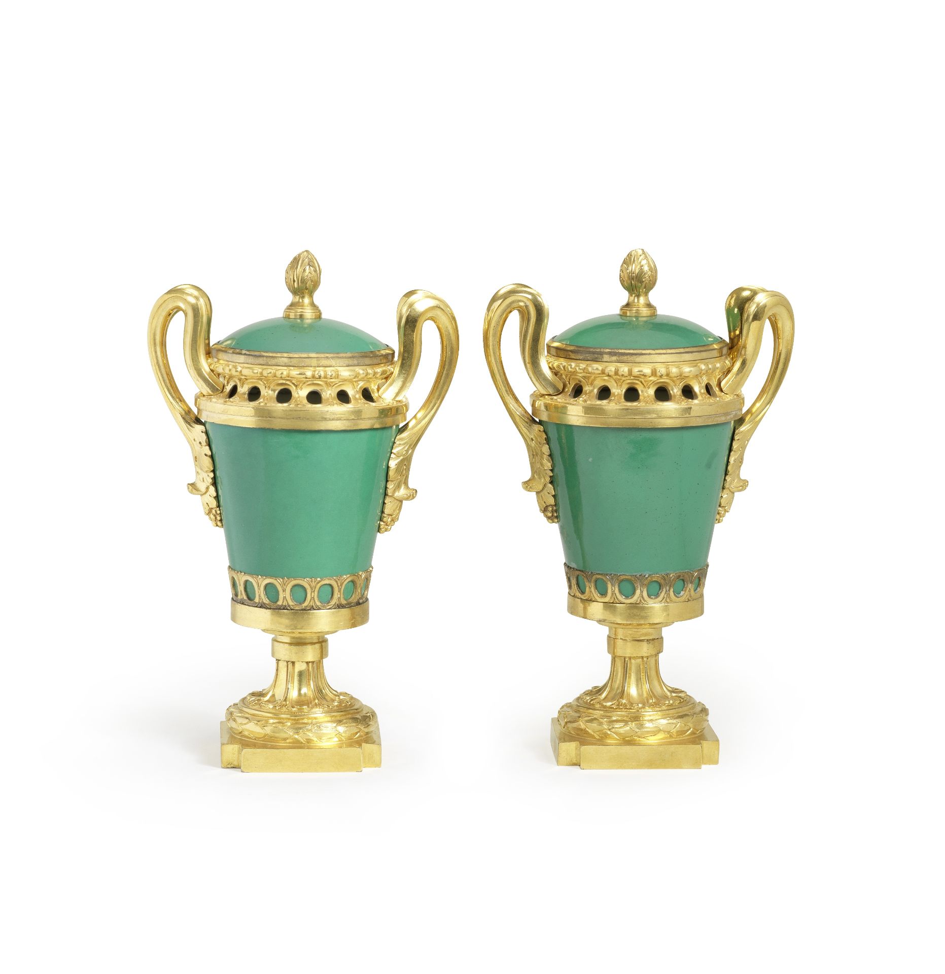 A pair of Louis XVI gilt bronze and apple-green glazed S&#232;vres porcelain pot pourri vases and...