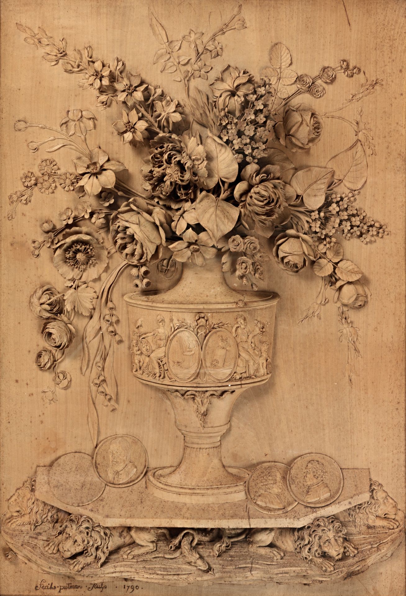 A rare late 18th century relief-carved lime wood panel depicting a vase of flowers, signed and da...