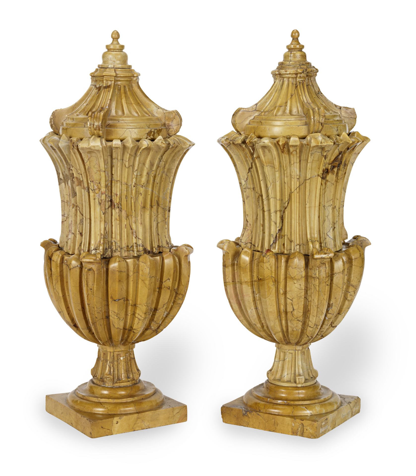 A pair of Italian carved Sienna marble urns and covers probably 18th century (2)