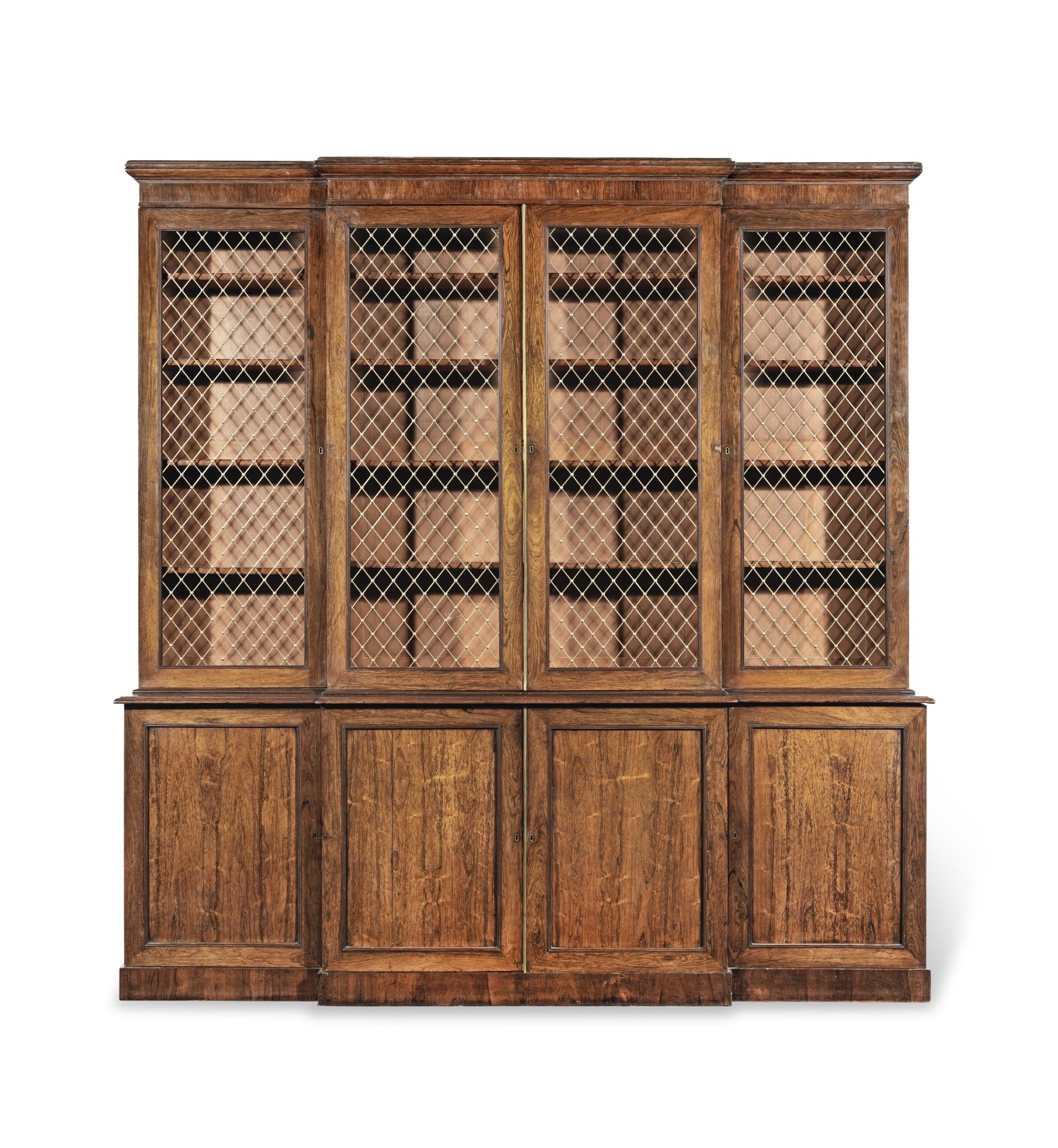 A Regency rosewood and brass mounted breakfront bookcase