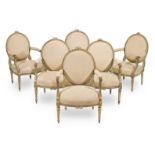 A set of six Louis XVI painted and parcel gilt fauteuils in the manner of Georges Jacob (6)