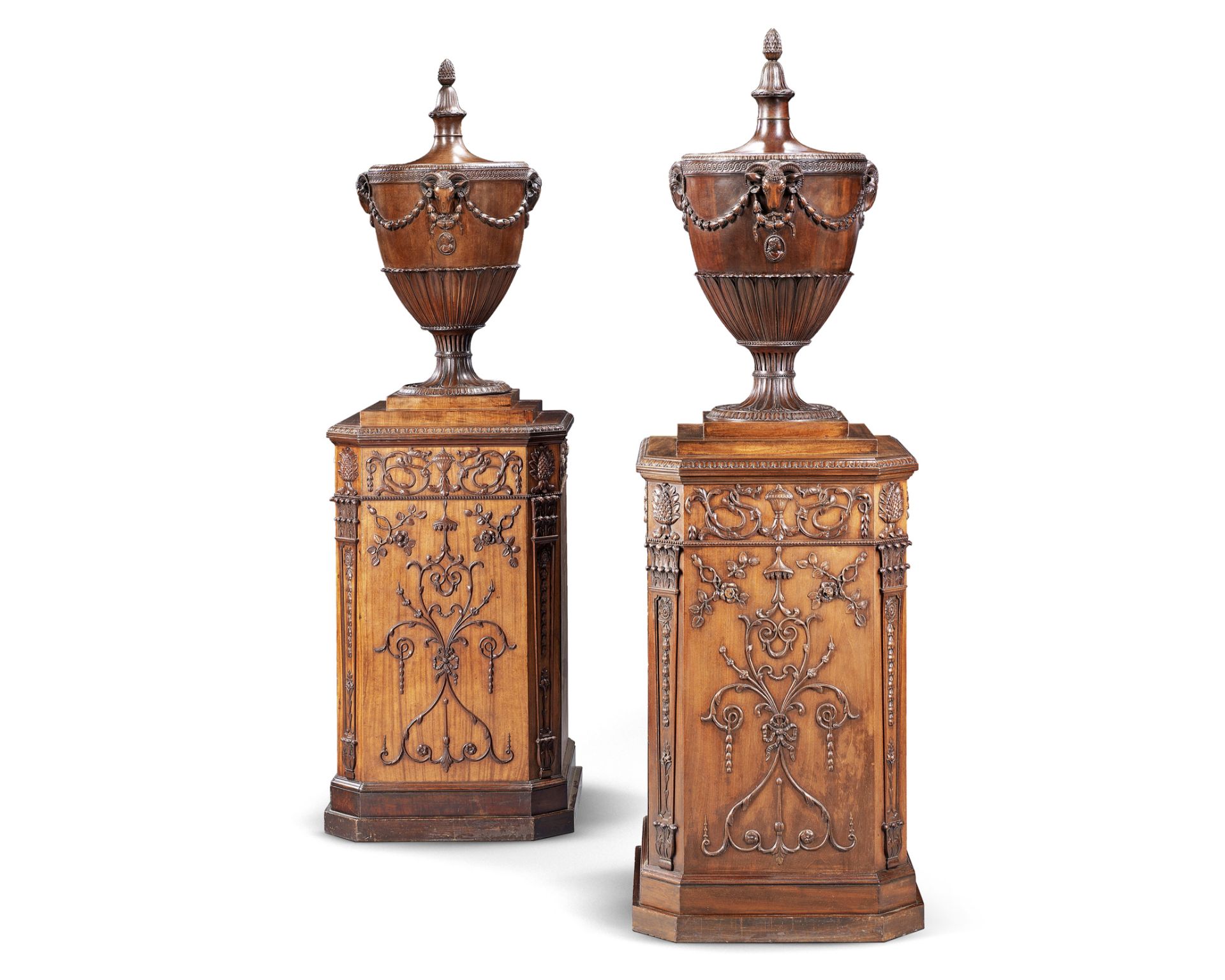 A matched pair of satinwood and carved mahogany urns and pedestals one urn and pedestal circa 177...