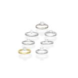 COLLECTION OF SEVEN DIAMOND SINGLE-STONE RINGS (7)