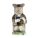 A Creamware 'Village Idiot' Toby Jug, circa 1790