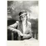 BEATON (CECIL) - ELIZABETH II Fine portrait photograph of Princess Elizabeth, seated facing forwa...