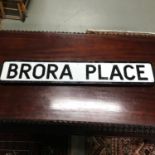 A Dunfermline street sign "Brora Place" Made from metal has brackets to the back. Measures 15x91cm