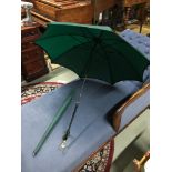 A vintage parasol in an Everest green shade by Paragon S Fox & Co Ltd, handle has racing trinkets
