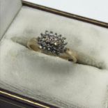 A Ladies 9ct gold ring set with a diamond cluster, Ring size K, Weighs 2.49grams.