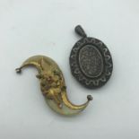 A Birmingham silver locket together with a Victorian gilt metal ornate brooch.