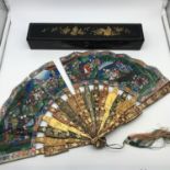 Antique oriental hand painted and lacquered fan with gilt decoration. Comes with original