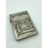 A White metal Arabic cigarette case. Measures 9cm in height