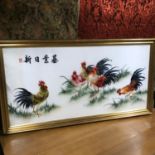 A Large oriental silk tapestry which depicts cockerels. Fitted within a large gilt frame. Frame