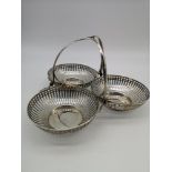 A Birmingham silver pierced three section condiment serving basket. Maker E S Barnsley & Co (