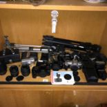 A Collection of canon cameras and equipment which includes Canon EOS3000, EOS500N & EOSREBEL.