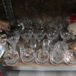 A Shelf of crystal wares which includes Vintage Babycham cocktail glasses, Irish etched boots and