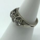 An 18ct white gold ladies ring set with 3 diamonds, Ring size J, Weighs 3.92grams