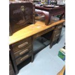 A Light oak knee hole desk possibly an old school desk. Measures78X152X78CM