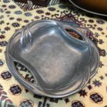 An Art Nouveau pewter two handle dish. Measures 27cm in diameter