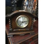 An Edwardian mantel clock in working condition. Measures 19x22x8.5cm