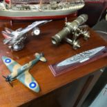 A lot of four military models which includes heavy chrome fighter desk clock, Spitfire model,