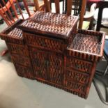 An Oriental style console unit. Measures 70x87x33cm