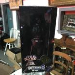 A Vintage 1990's Star Wars 12" Darth Vader figure with box.