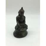 A 17th century bronze figure of a Chinese Buddha, Measures 10.5cm in height