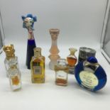 A Collection of vintage perfume bottles containing perfume. Includes Marina Picasso Chapeau