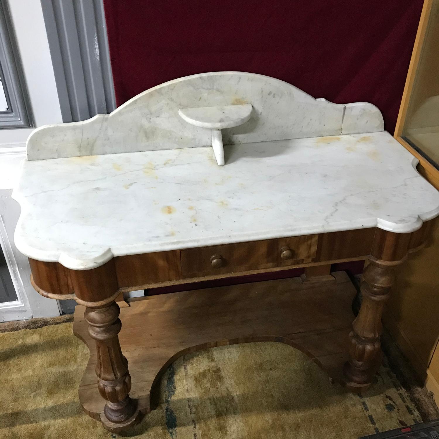 A Victorian Console table, Table top is made of solid marble. Originally used as a wash stand. Has