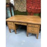 A Solid light wood early 1900's knee hole desk, 5 fitted drawers. Desk measures 77x153x91cm