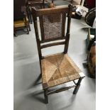 Antique farm house rustic chair, designed with bergere back support and weaved wicker base seat.