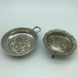 A Silver 925 ornate raised relief porringer. Together with a white metal three foot dish- P.W.C.C.