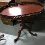 A reproduction pedestal gallery serving table
