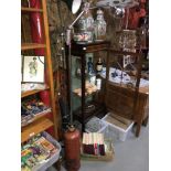 Antique fire extinguisher fitted with angle poise standard lamp. In a working condition