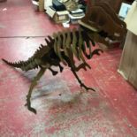 A large hand made metal T/Rex skeleton sculpture.