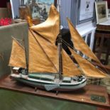 A Vintage model sailing barge on a wooden display stand, Brass plaque engraved "Thames Sailing Barge