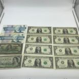 A Lot of 12 vintage bank notes which includes eight One dollar U.S.A Bank notes with varied dates