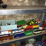 A Shelf of various bus models and Britains farm animals, Tractor and accessories